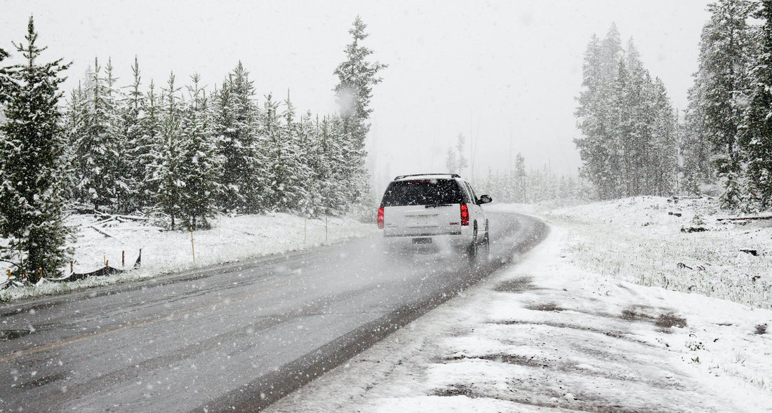 A Car Driving Through the Snow